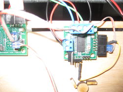 This photo shows the cable going from the SDA/SCL of the RepRap mainboard to the ten pin connector on the stepper controller, it also shows the wire used to enable the stepper controller