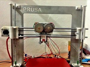 Prusa i3 with an unnamed dual extruder mounted.