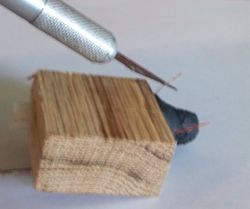 Use a sharp knife to strip the ends of the wire.