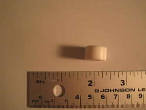 Cylindrical piece. Another insulator?
