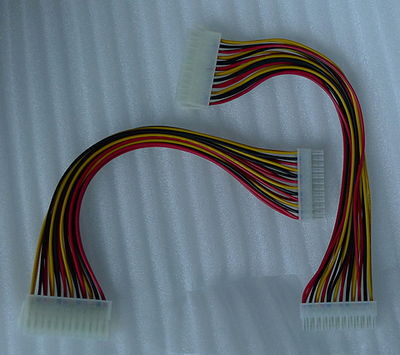 A pair of 24-pin female to male adapter cables.